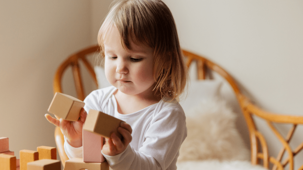 A child playing with wooden blocks