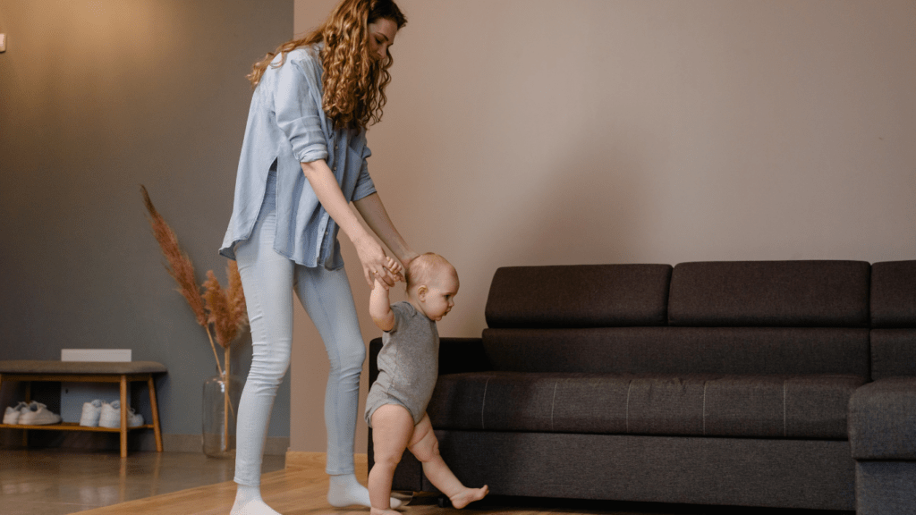 A person and a baby are standing