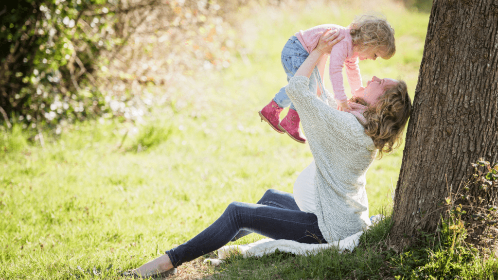 A person holding a child in the air