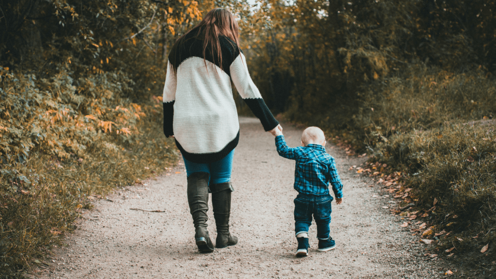 A person and a baby are standing