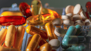 an assortment of vitamins and supplements on a white surface