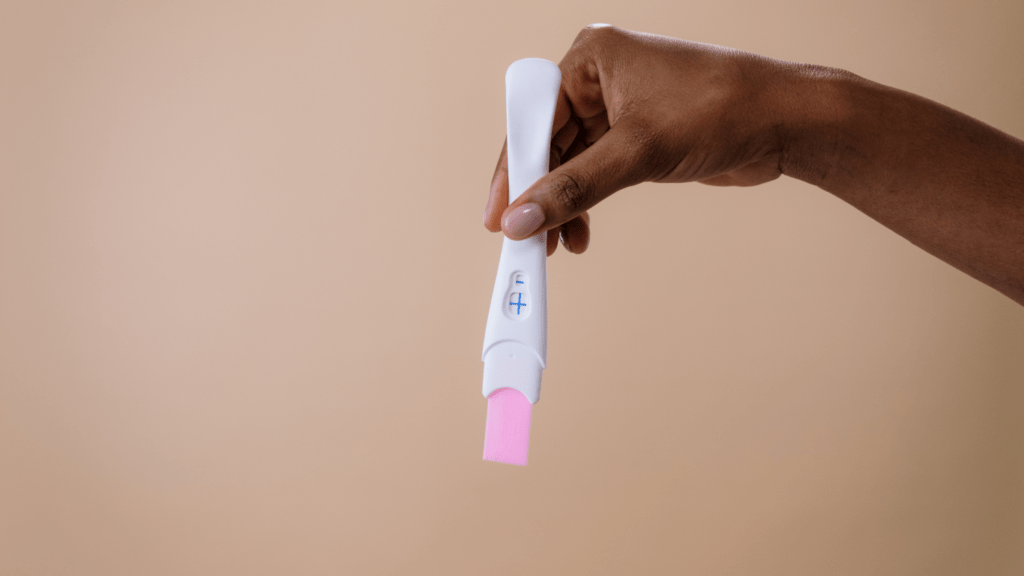 a person holding a thermometer in their hand