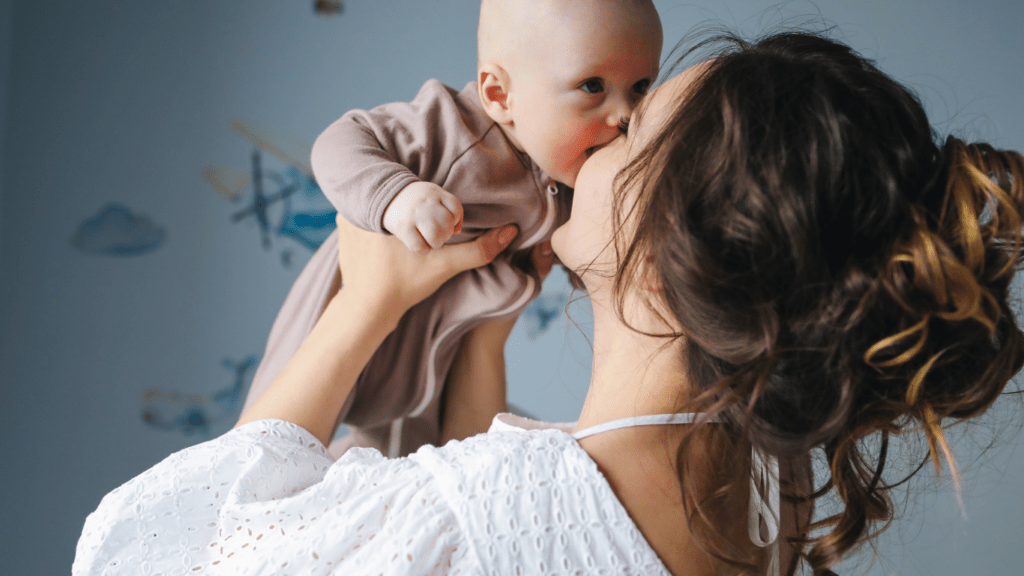 A person holding a child in the air