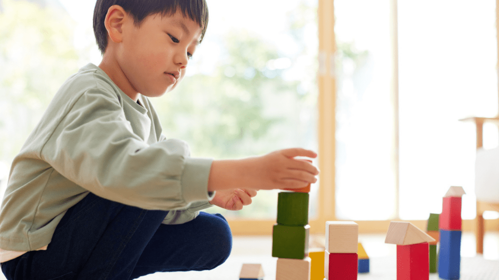 A child playing with wooden blocks