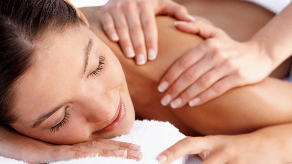 a person getting a back massage at a spa