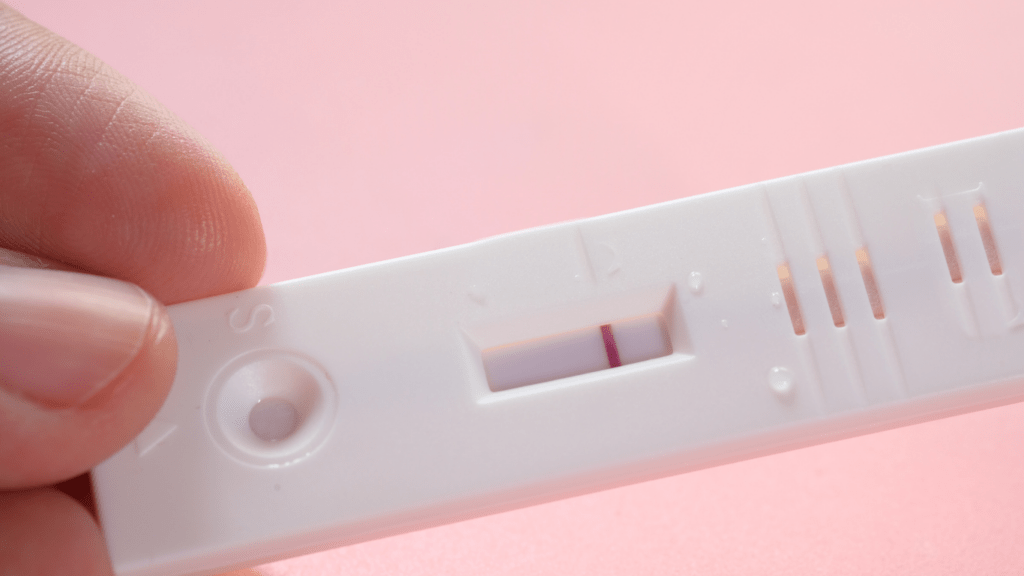 a person holding a thermometer in their hand