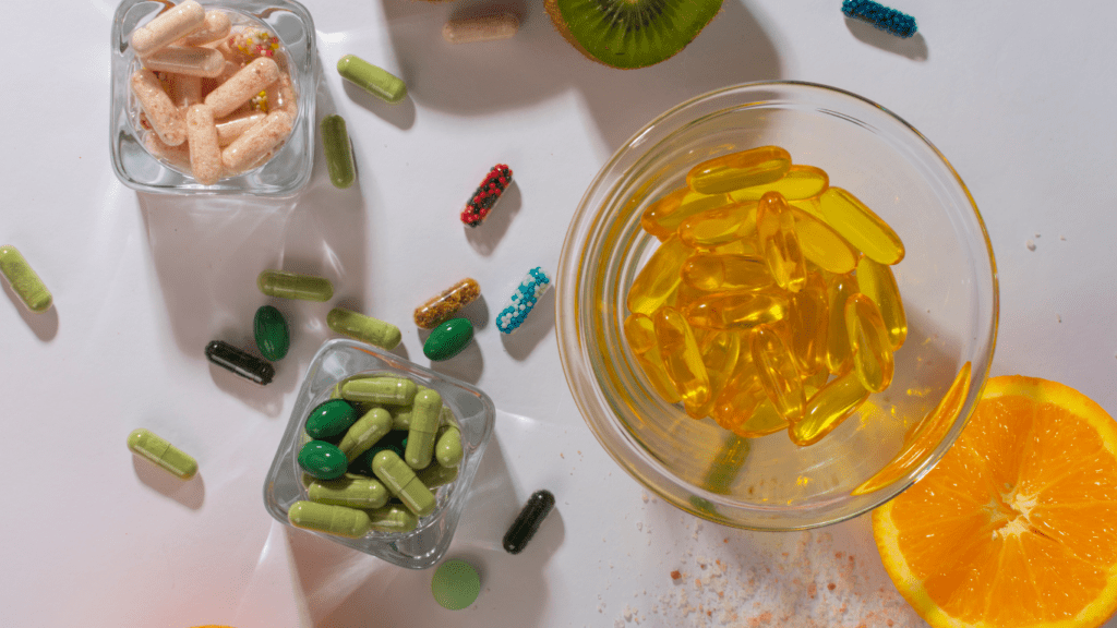 an assortment of vitamins and supplements on a white surface
