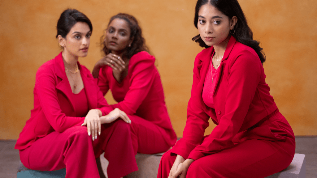 group of people wearing a red suit