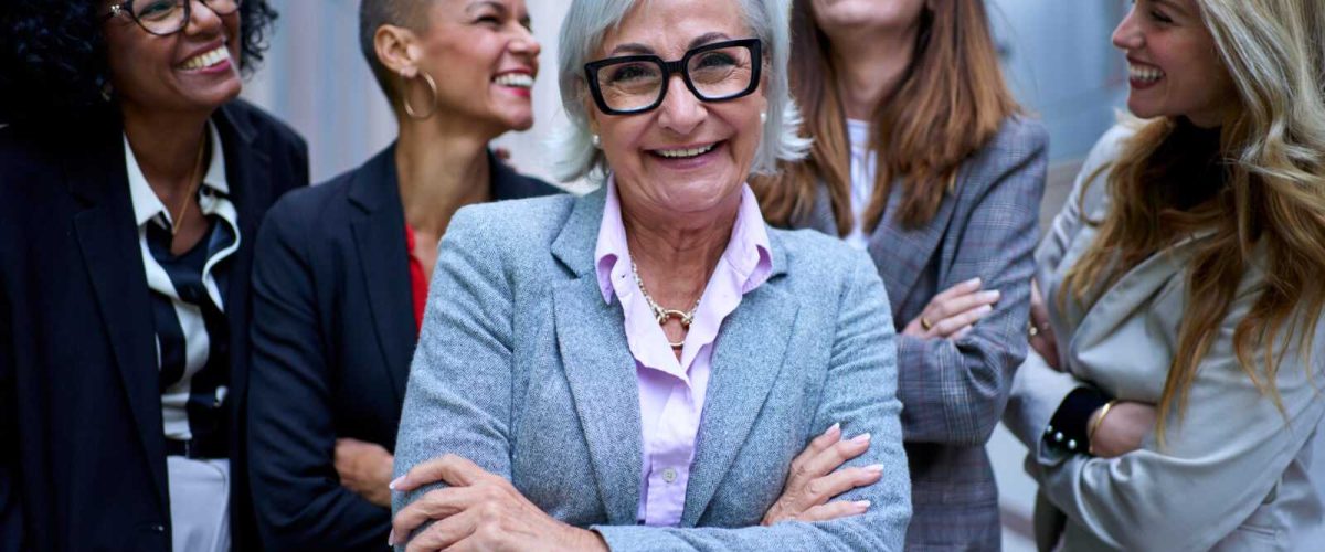 Leadership lady looking at camera and group entrepreneur formal females joyful, arms crossed outdoor Leadership lady looking at camera and group entrepreneur formal females joyful, arms crossed outdoor